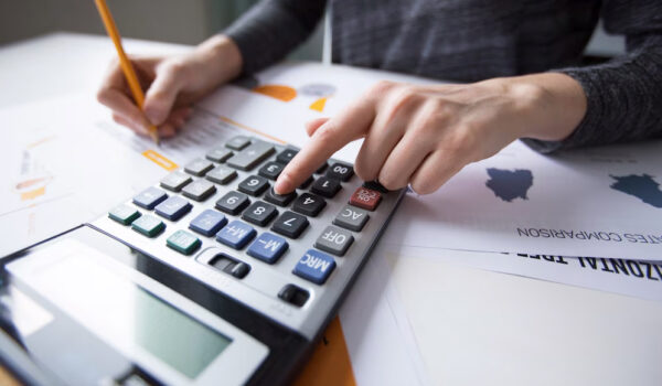 close-up-female-hand-counting-with-calculator_1262-3167